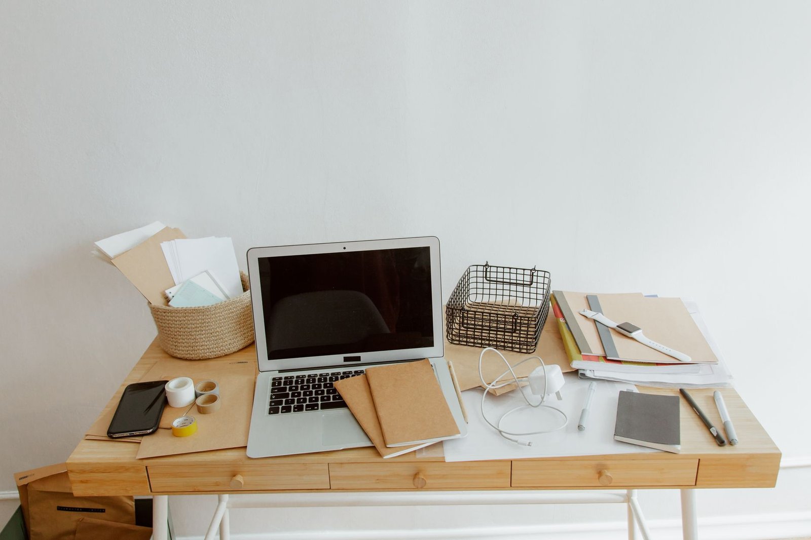 Clean, organized desk with notebooks